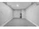 A spacious garage with clean, painted walls and smooth concrete flooring at 6347 S Lansdale Cir, Tampa, FL 33616