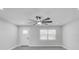 Modern living room with fan, new flooring, and contemporary trim at 6347 S Lansdale Cir, Tampa, FL 33616