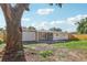 The backyard showcases a charming patio, a well-maintained lawn, and a privacy fence at 7110 Bonito St, Tampa, FL 33617