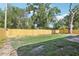 A new wooden fence surrounds this large backyard, creating a private and secure outdoor space at 7110 Bonito St, Tampa, FL 33617