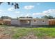 Spacious backyard with a covered patio and new fence; perfect for outdoor gatherings at 7110 Bonito St, Tampa, FL 33617