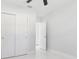 Bedroom featuring marble-look flooring, a double-door closet, and white walls at 7110 Bonito St, Tampa, FL 33617