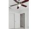 Stylish bedroom showcasing a modern ceiling fan, closet and neutral paint at 7110 Bonito St, Tampa, FL 33617