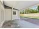 Covered patio looking out to the yard, perfect for outdoor relaxation and entertaining at 7110 Bonito St, Tampa, FL 33617