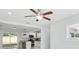 Living area showcasing the open floor plan, updated lighting, and seamless flow into the kitchen at 7110 Bonito St, Tampa, FL 33617