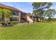 Expansive backyard showcasing a well-maintained lawn and inviting outdoor living spaces at 8103 Bardmoor Pl # 203G, Seminole, FL 33777
