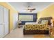 Bedroom with palm ceiling fan, closet and beach themed decor at 8103 Bardmoor Pl # 203G, Seminole, FL 33777
