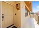 Inviting front entrance with a well-lit porch, showcasing a secure door with modern hardware at 8103 Bardmoor Pl # 203G, Seminole, FL 33777