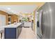 Modern kitchen with island seating, stainless appliances, and bright, open concept design at 8103 Bardmoor Pl # 203G, Seminole, FL 33777