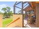 Inviting screened lanai offers golf course views and access to the lush outdoors at 8103 Bardmoor Pl # 203G, Seminole, FL 33777