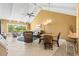 Inviting living room boasting vaulted ceilings, large windows, and comfortable seating area at 8103 Bardmoor Pl # 203G, Seminole, FL 33777