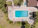 Overhead shot of the community pool area complete with lounge chairs, tables, and a hot tub at 8103 Bardmoor Pl # 203G, Seminole, FL 33777