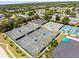 Aerial view featuring multiple well-maintained tennis courts within a fenced community at 8103 Bardmoor Pl # 203G, Seminole, FL 33777
