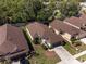 Charming single-story home featuring a well-manicured lawn and mature trees in a peaceful neighborhood setting at 9200 Halberg Dr, Hudson, FL 34669