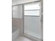 Features a glass enclosed shower with textured glass and silver metal trim at 9200 Halberg Dr, Hudson, FL 34669