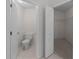 Bathroom featuring a toilet and an open door to a walk in closet with wire shelving at 9200 Halberg Dr, Hudson, FL 34669
