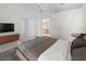 Spacious bedroom featuring soft carpet, ample closet space, and a large window for natural light at 9200 Halberg Dr, Hudson, FL 34669