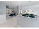 Open-concept dining area with modern table, elegant chairs, and light-filled living space in view at 9200 Halberg Dr, Hudson, FL 34669