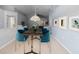 Dining area featuring a modern table with seating for six, stylish decor, and an inviting ambiance at 9200 Halberg Dr, Hudson, FL 34669
