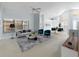 Bright and airy living space with open floor plan, stylish furniture, and an adjacent dining area at 9200 Halberg Dr, Hudson, FL 34669