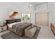 Inviting main bedroom boasting neutral tones, soft lighting, and a comfortable seating area at 9200 Halberg Dr, Hudson, FL 34669