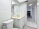 Clean, tiled bathroom with a vanity and a doorway leading to another room at 1 Boca Ciega Point Blvd # 215, St Petersburg, FL 33708