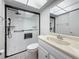 Modern bathroom featuring a glass-enclosed shower, vanity and skylight at 1 Boca Ciega Point Blvd # 215, St Petersburg, FL 33708