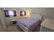 Inviting bedroom featuring natural light through the windows, comfortable carpet, and convenient closet access at 1 Boca Ciega Point Blvd # 215, St Petersburg, FL 33708