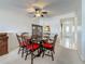 Dining area with ceiling fan, adjacent to the entry hallway at 1 Boca Ciega Point Blvd # 215, St Petersburg, FL 33708
