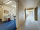 Hallway leading to community laundry room featuring multiple washing machines and utility sink at 1 Boca Ciega Point Blvd # 215, St Petersburg, FL 33708