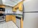 Bright kitchen area with stainless steel appliances and laminate countertops at 1 Boca Ciega Point Blvd # 215, St Petersburg, FL 33708