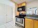 Well-equipped kitchen with stainless steel oven and microwave at 1 Boca Ciega Point Blvd # 215, St Petersburg, FL 33708