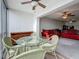 Open-concept living room featuring comfortable seating, a glass table and great view of the outdoors at 1 Boca Ciega Point Blvd # 215, St Petersburg, FL 33708