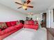 The living room has cozy seating, neutral carpeting, and a seamless flow into the adjacent dining area at 1 Boca Ciega Point Blvd # 215, St Petersburg, FL 33708