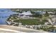 Aerial view of waterfront park with green space, walking paths, covered stage, and water views at 100 Pierce St # 910, Clearwater, FL 33756