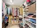 Walk-in closet with custom shelving and ample storage space for clothes and accessories at 100 Pierce St # 910, Clearwater, FL 33756