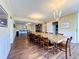Over-sized dining room with light wood floors, grand table, and plenty of seating at 100 Pierce St # 910, Clearwater, FL 33756