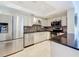 Modern kitchen boasts stainless steel appliances, granite countertops, and updated cabinetry for a sleek design at 100 Pierce St # 910, Clearwater, FL 33756