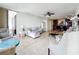 Open floorplan living room with neutral tones, comfortable seating, and views of the water and kitchen area at 100 Pierce St # 910, Clearwater, FL 33756