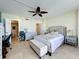 Comfortable main bedroom with closet access, large bed, and ceiling fan offers a relaxing retreat at 100 Pierce St # 910, Clearwater, FL 33756