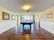 Large billiards room with dark wood floors, soft lighting, and views at 100 Pierce St # 910, Clearwater, FL 33756
