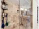 This remodeled bathroom features a tiled shower with built-in shelving and a glass enclosure at 100 Pierce St # 910, Clearwater, FL 33756