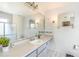 Bright bathroom features an expansive vanity with a sink and a glass-enclosed shower area at 1024 Dockside Dr, Lutz, FL 33559