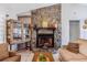 Close-up of the living room's stone fireplace, adding a touch of rustic charm to the home at 1024 Dockside Dr, Lutz, FL 33559