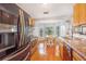 View of the kitchen, stainless steel appliances, wooden cabinetry, and dining area at 1024 Dockside Dr, Lutz, FL 33559