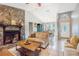 Spacious living room view, showcasing the open layout, fireplace, and access to the dining area at 1024 Dockside Dr, Lutz, FL 33559