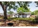 Lovely backyard featuring a tire swing hanging from a mature tree, creating a playful outdoor space at 103 N Meteor Ave, Clearwater, FL 33765