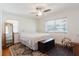 Bright bedroom features light colored walls, hard wood floors, and vintage furniture at 103 N Meteor Ave, Clearwater, FL 33765