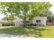 Charming single-story home with a lush front yard and mature shade tree at 103 N Meteor Ave, Clearwater, FL 33765