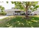 Charming single-story home with a lush front yard and mature shade tree at 103 N Meteor Ave, Clearwater, FL 33765